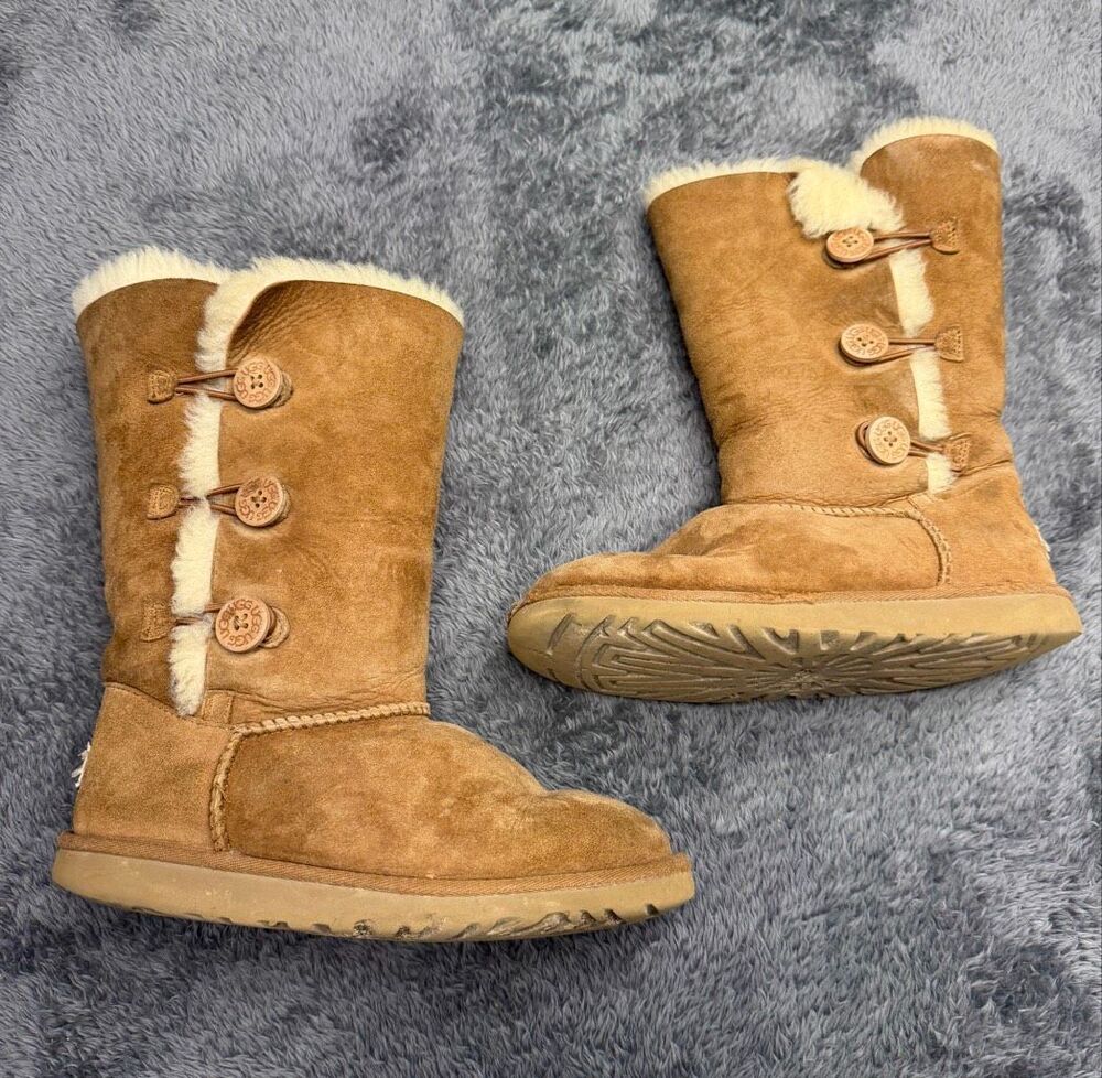 UGG Bailey Button Triplet Boots in fair shape. Size Women’s 5